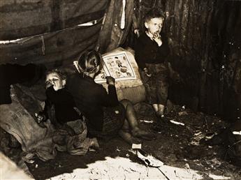 MARION POST WOLCOTT (1910-1990) Three photographs depicting the children of migrant packing house workers who are living in a lean to